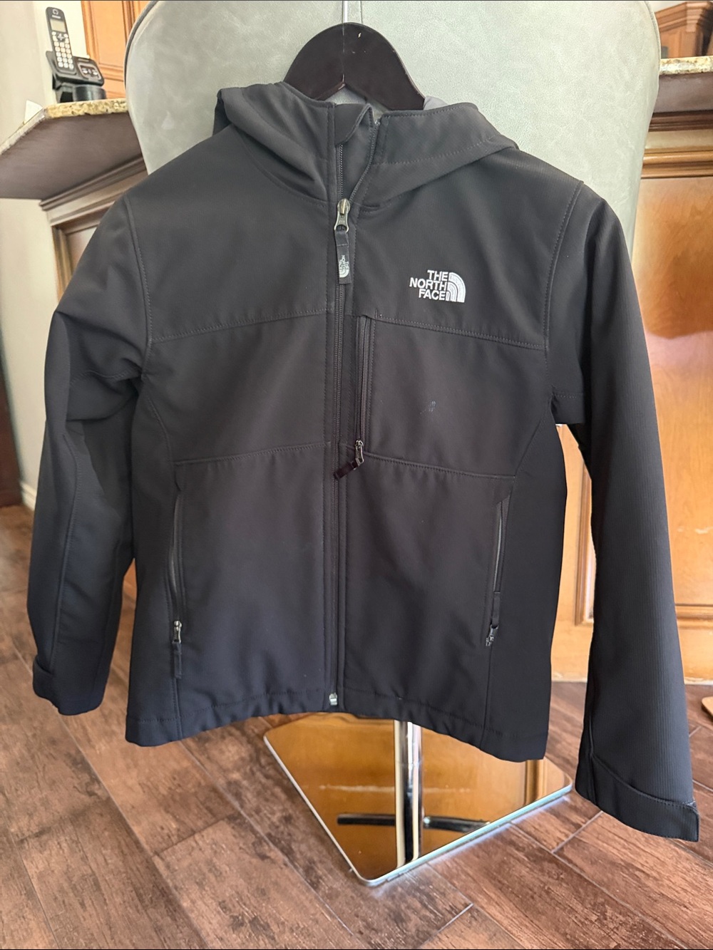 The North Face Kids Black Hooded Jacket.
